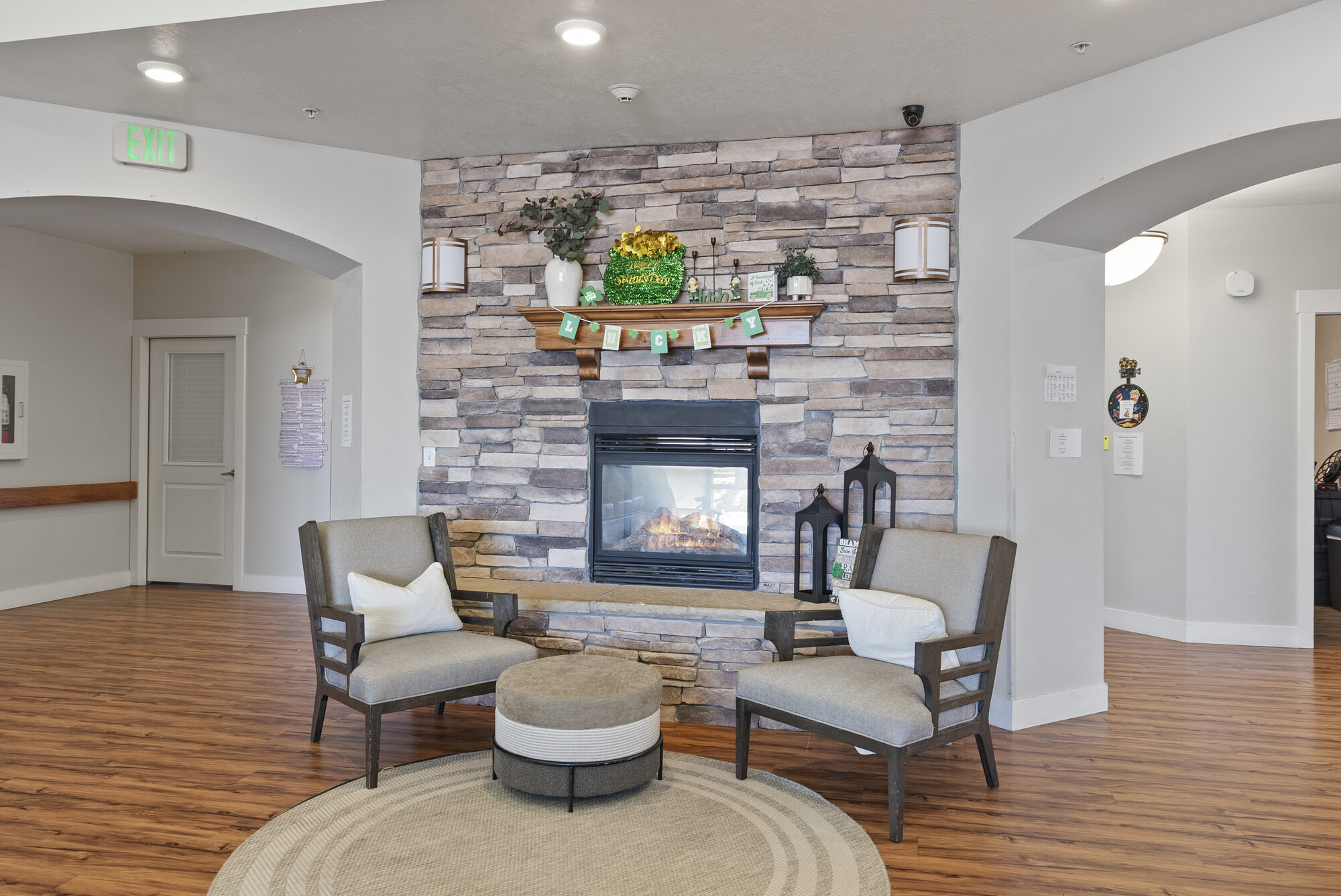Cozy seating area with two upholstered chairs and a round rug